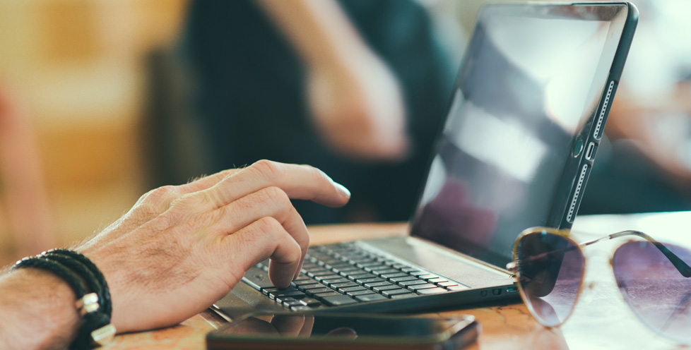 photo of man working on laptop